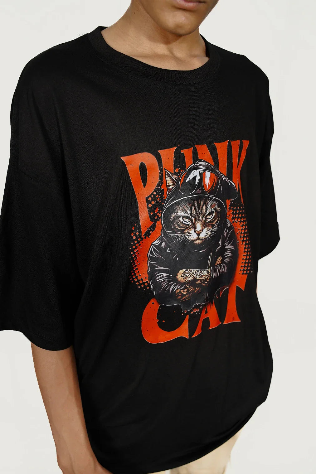 Model wearing black Punk Cat Rebel oversized streetwear t-shirt showing front graphic design
