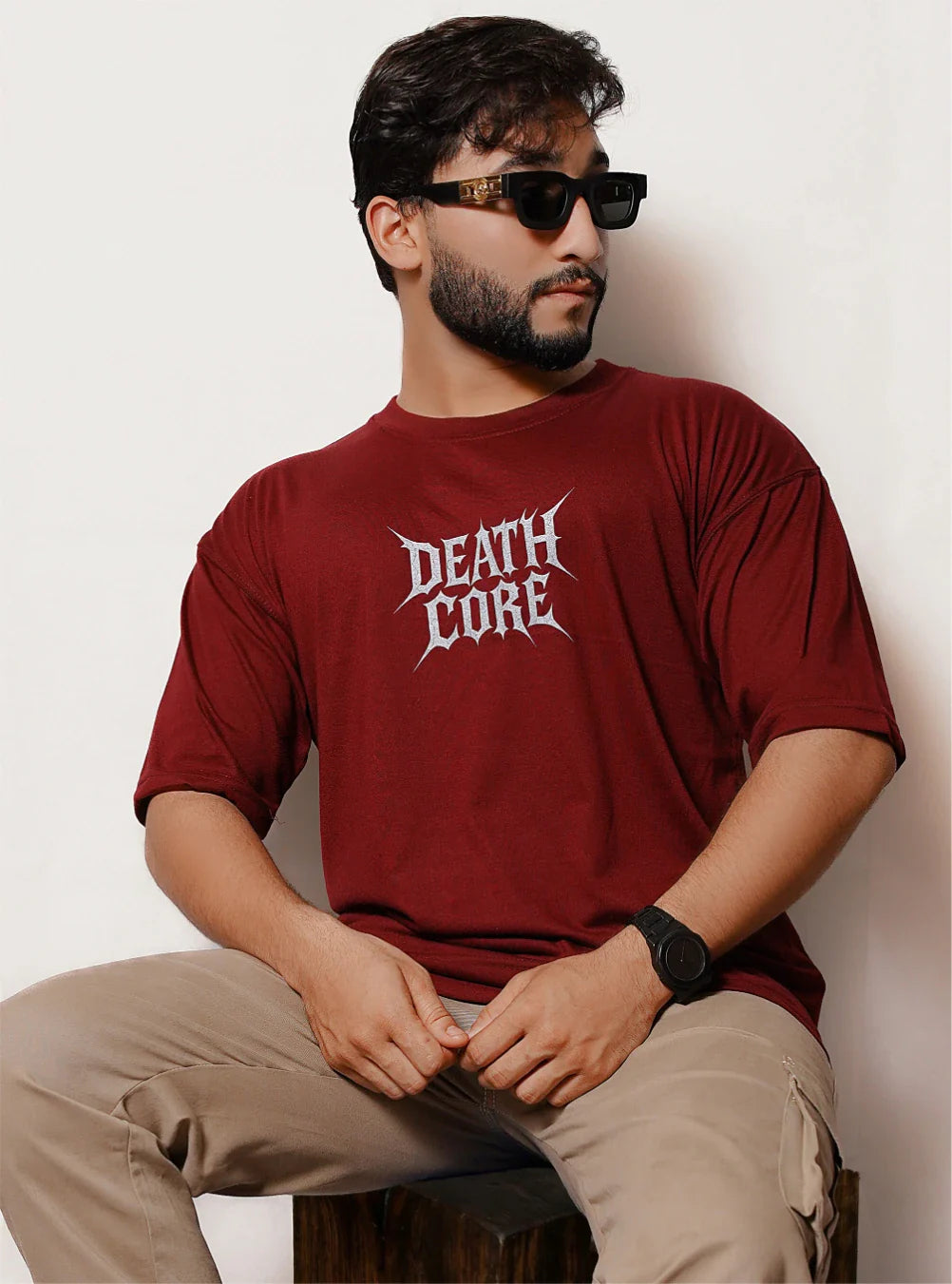 Close-up of maroon Death Core oversized t-shirt front typography graphic design