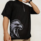 Close-up of Model wearing black Falcon oversized drop-shoulder t-shirt with minimalist front insignia