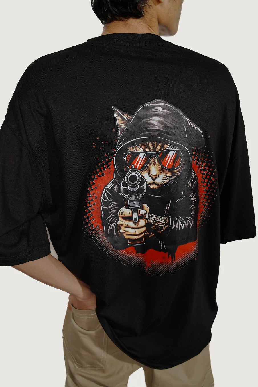 Model wearing black Punk Cat Rebel oversized streetwear t-shirt showing back graphic design