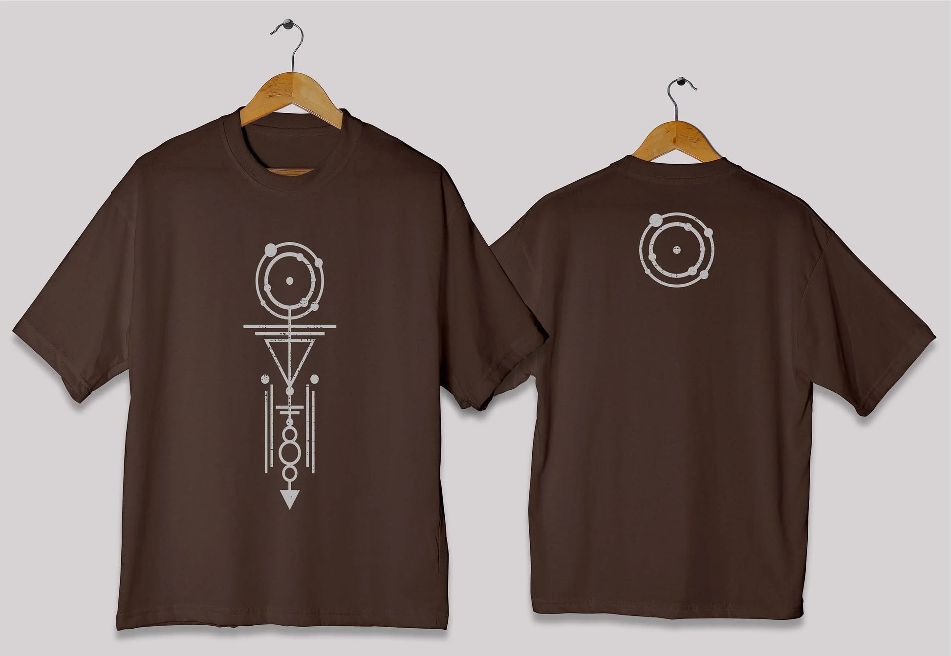 Vertical geometric symbol oversized t-shirt in [chocolate brown] for men and women in Pakistan with minimal abstract design.
