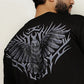 Model wearing black Falcon oversized streetwear t-shirt showing large falcon emblem back design